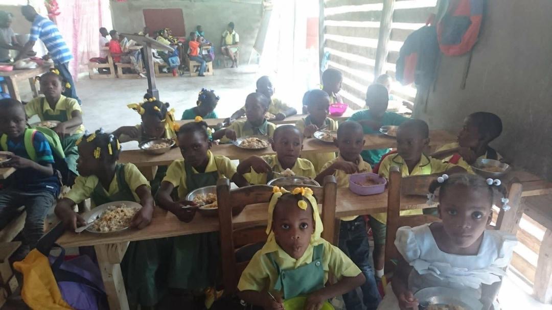 Children enjoying lunch together in the cafeteria