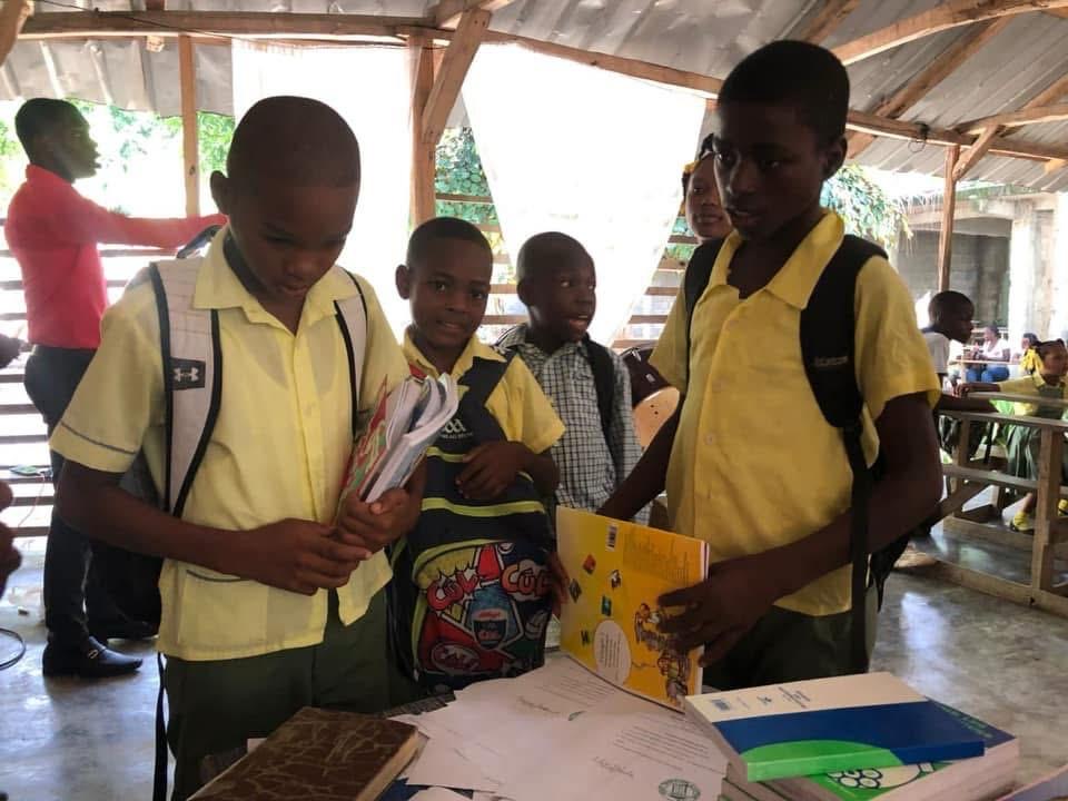 Students receiving new schoolbooks