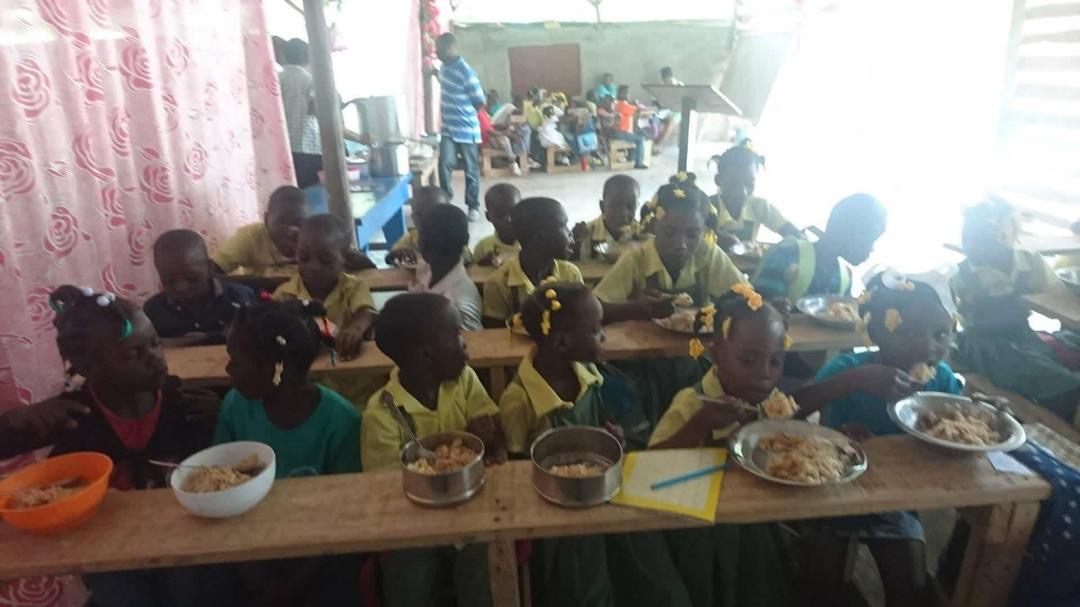 Students eating a hot meal at school